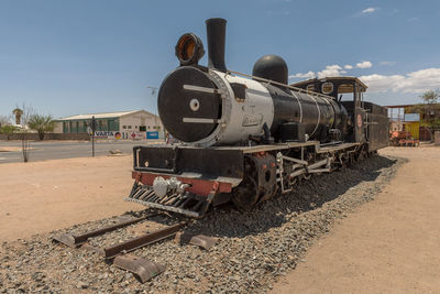 Train on railroad track against sky