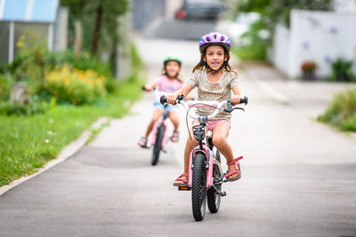 Portrait of happy girl riding bicycle