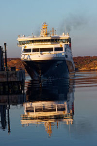 Ship moored in sea against sky