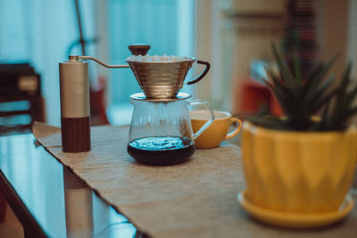 Close-up of coffee cup on table at home