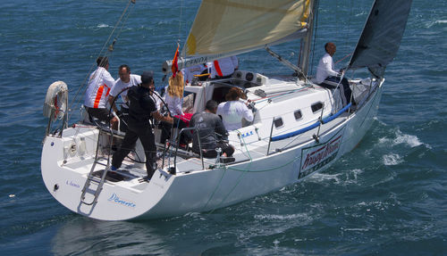 Men sailing a yacht on sea