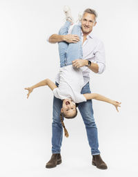 Portrait of happy friends against white background