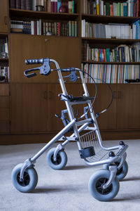 Wheeled wlaker in front of a book shelf
