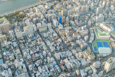 High angle view of crowd and buildings in city