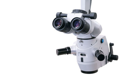 Close-up of vintage camera against white background