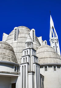 Low angle view of building against clear blue sky