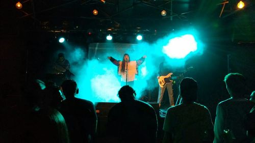 People enjoying music concert