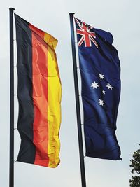 Low angle view of flag against sky