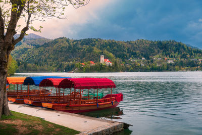 Pletna traditional boats in bled lake ,slovenia, in a cloudy day. 