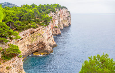 Scenic view of rocks by sea