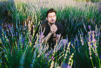 Portrait of young man in garden