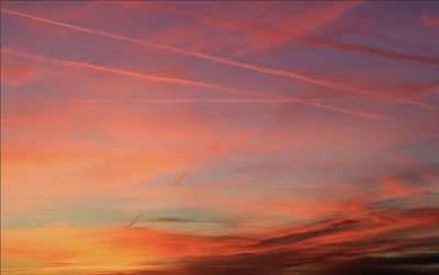 Low angle view of cloudy sky at sunset