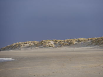 Scenic view of beach against clear sky