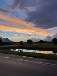 Scenic view of lake against sky during sunset