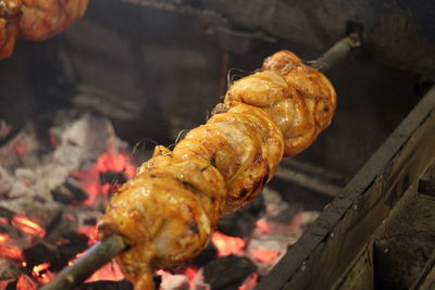 High angle view of meat on barbecue grill