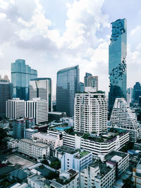 Modern buildings in city against sky