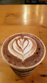 High angle view of cappuccino on table