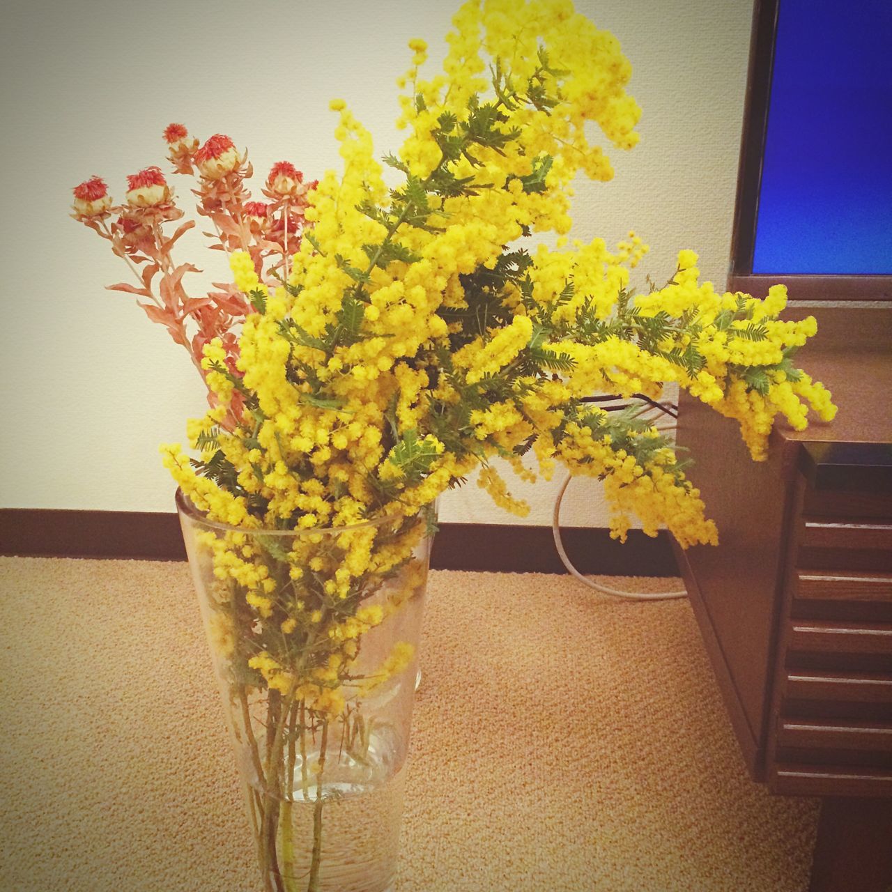 flower, yellow, freshness, growth, plant, fragility, vase, window, built structure, wall - building feature, architecture, potted plant, indoors, nature, leaf, building exterior, house, wall, sunlight, no people