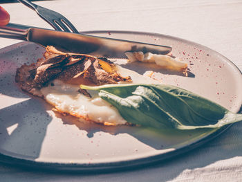 Close-up of meat in plate on table