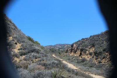 Scenic view of landscape against blue sky