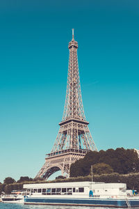 Low angle view of eiffel tower against blue sky