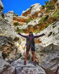 Full length of man standing on rock