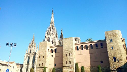 Low angle view of temple against blue sky