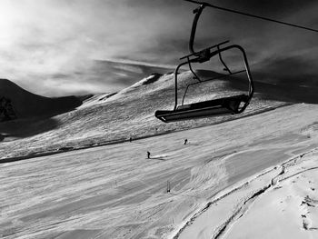 Low angle view of ski lift against sky