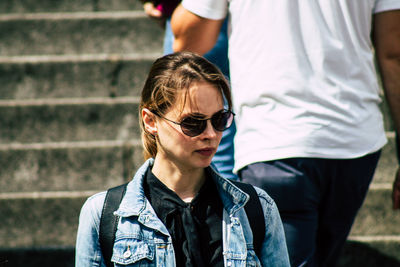 Mid adult man wearing sunglasses standing outdoors