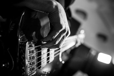 Close-up of man playing guitar