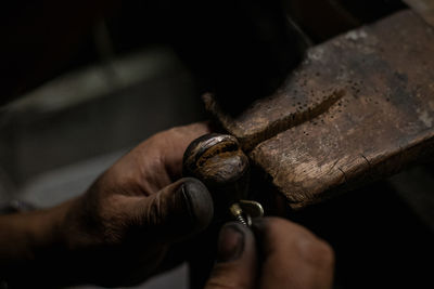 Close-up of man working on wood