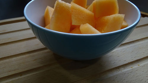 High angle view of chopped fruits in bowl on table