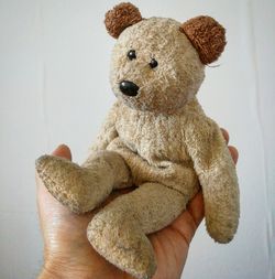 Close-up of hand holding stuffed toy