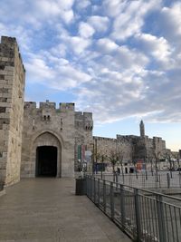 View of historic building against cloudy sky
