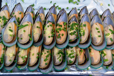 Close-up of mussels in aluminum foil