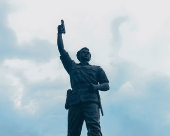Low angle view of statue against sky