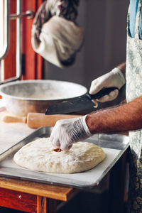 Midsection of man preparing food