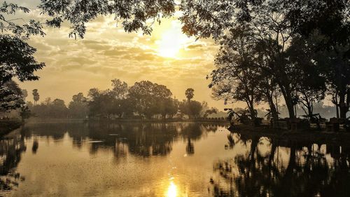 Scenic view of lake at sunset