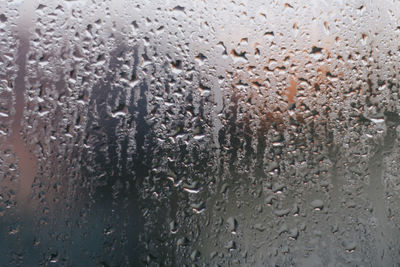 Full frame shot of wet glass window