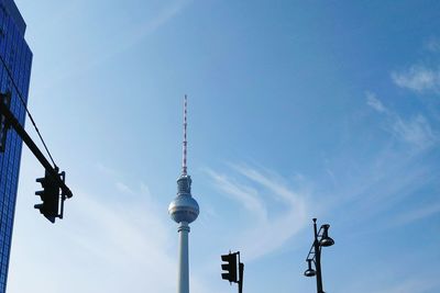 Low angle view of fernsehturm against blue sky