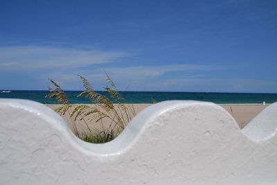 View of beach against blue sky