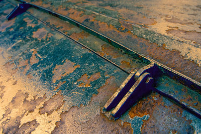 High angle view of rusty metal on floor