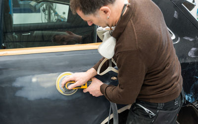 Engineer making car in workshop