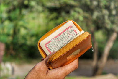 A muslim man is reading our holy qur'an