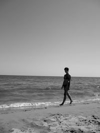 Woman standing on beach