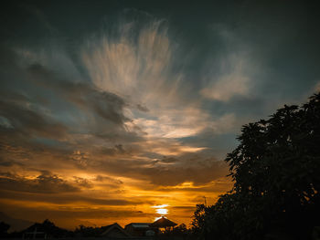 Low angle view of dramatic sky during sunset