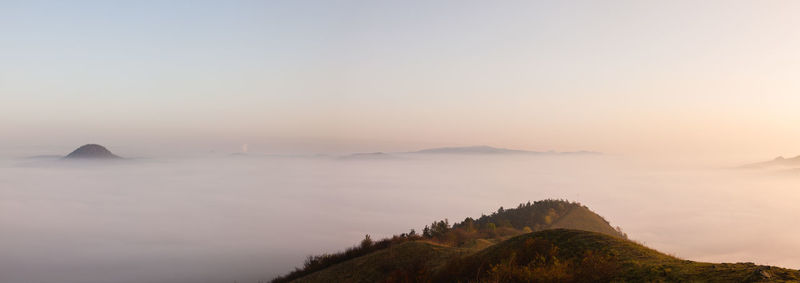 Scenic view of mountains against sky during sunset