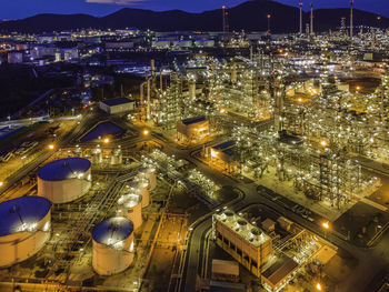 High angle view of illuminated buildings in city at night