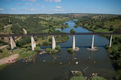 Bridge over lake against sky