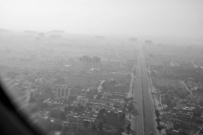 High angle view of buildings in city against sky